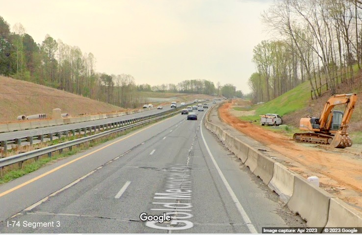 Image of widening work construction zone for future I-74/Winston-Salem Beltway beyond 
	  Westinghouse Road on US 52 South (Future I-74 East), Google Maps Street View, April 2023