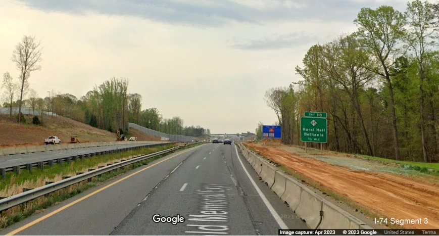 Image of 1/2 mile advance sign for NC 65 exit in construction zone for future I-74/
	  Winston-Salem Beltway on US 52 South (Future I-74 East), Google Maps Street View, April 2023