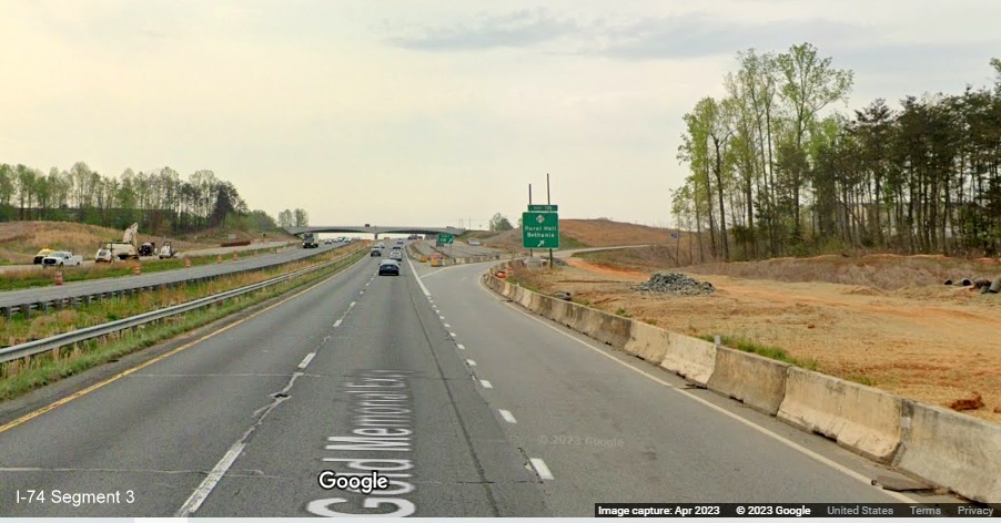 Image of ramp sign for NC 65 exit in construction zone for future I-74/Winston-Salem 
        Beltway on US 52 South (Future I-74 East), Google Maps Street View, April 2023