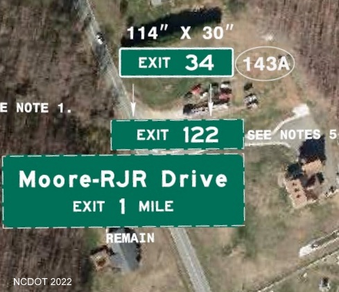Image of plan for new exit number tab with I-74 milepost number to be placed 
	  on sign for the 1 mile advance for the Moore-RJR Drive exit on US 52 in Forsyth County, NCDOT August 2022