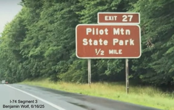 Image of renumbered brown 1/2 Mile advance sign for the Pilot Mountain State Park
	  exit on US 52 South (Future I-74 East), screen grab from Benjamin Wolf video, June 2025