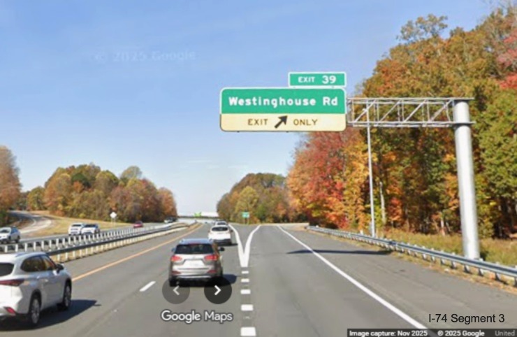 Image of renumbered overhead ramp sign for the Westinghouse
	  Road exit on US 52 North (Future I-74 West), Google Maps Street View, November 2025