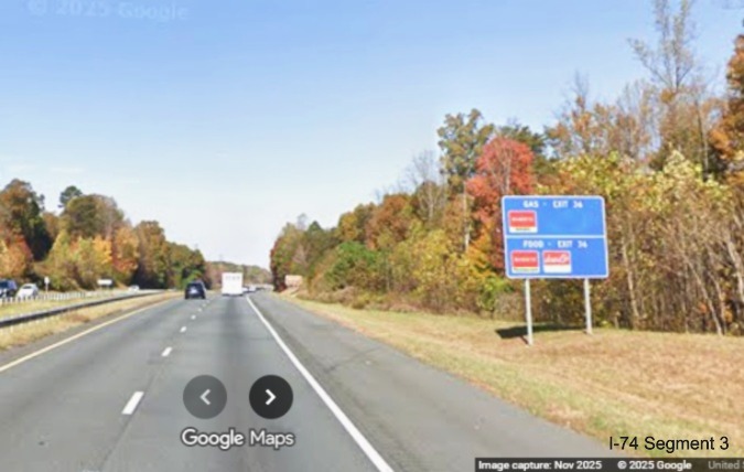 Image of renumbered blue services sign for the Moore-RJR Drive exit
	  on US 52 North (Future I-74 West), Google Maps Street View, November 2025