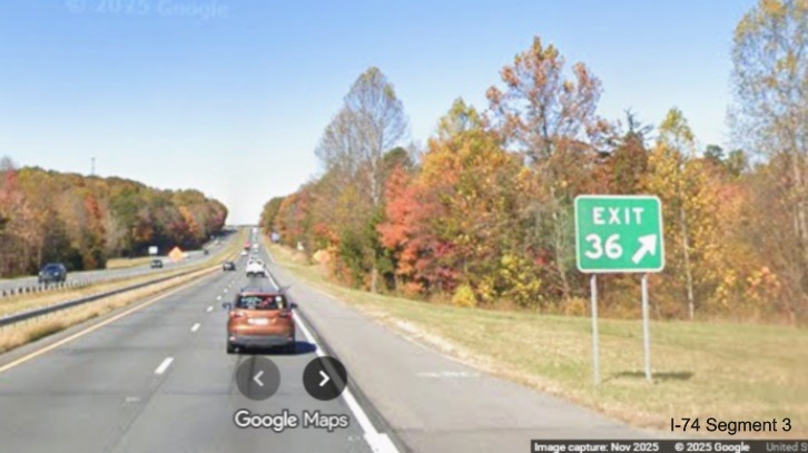 Image of renumbered gore sign for the Moore-RJR Drive exit
	  on US 52 North (Future I-74 West), Google Maps Street View, November 2025
