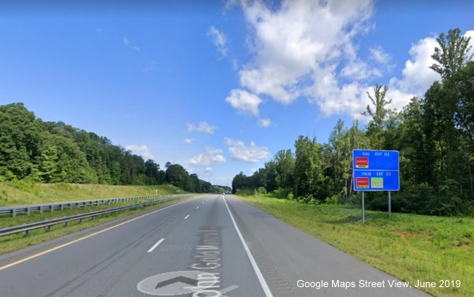 Google Maps Street View image of blue services sign for Moore-RJR 
	  Drive exit on US 52 North/Future I-74 West in Rural Hall, taken in June 2019