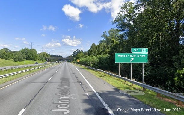 Google Maps Street View image of ground mounted ramp sign for the 
	  Moore-RJR Drive exit on US 52 North/Future I-74 West in Rural Hall taken in June 2019