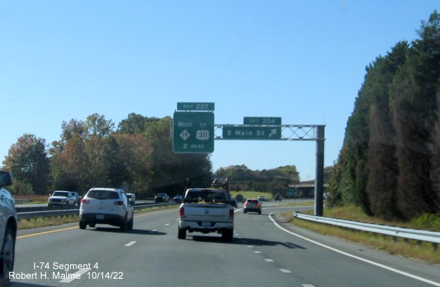 Image of 2 miles advance overhead sign for NC 74 (Future I-74) West Winston-Salem Northern Beltway 
        exit on US 421 North/Salem Parkway in Kernersville, October 2022