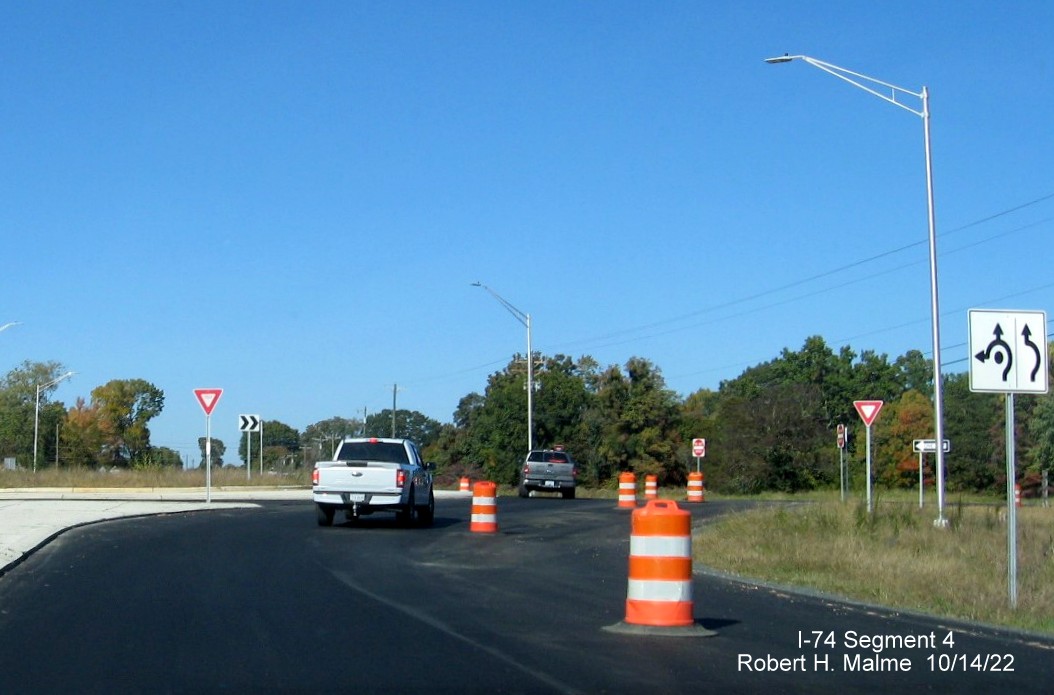 Image of entering roundabout on NC 8/Germanton Road north of the bridge across the Winston-Salem Northern
        Beltway for future ramp to NC 74 West, October 2022