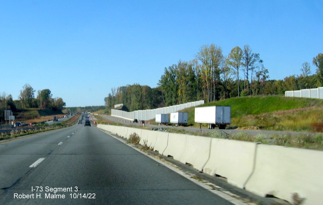 Image of US 52 North roadway approaching merge with NC 65 exit in I-74/Winston-Salem 
	  Northern Beltway interchange construction zone in Rural Hall, October 2022