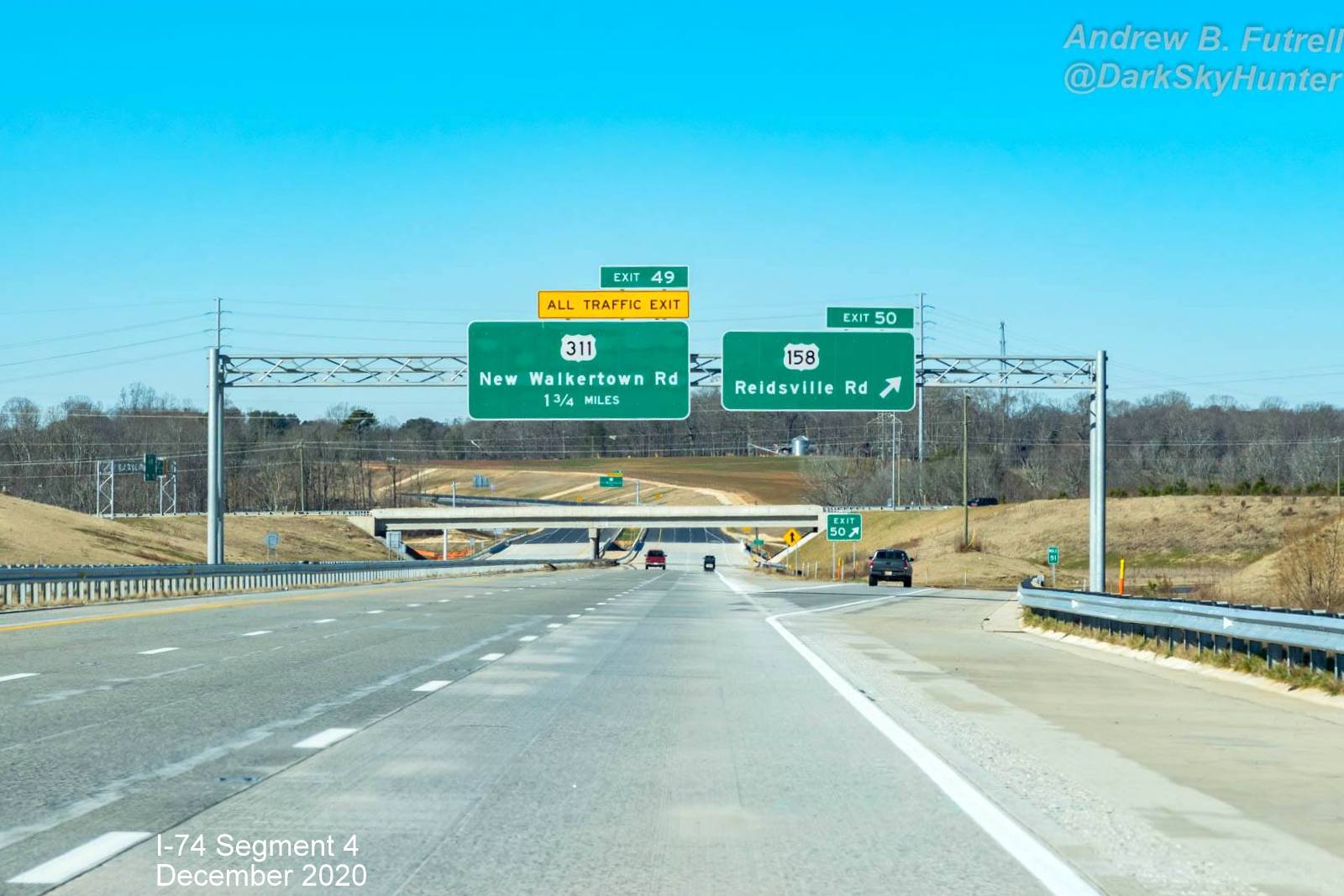Image of overhead signs for newly opened section of NC 74 (Future I-74) West Winston-Salem Northern 
        Beltway, by Andrew F. Futrell, December 2020