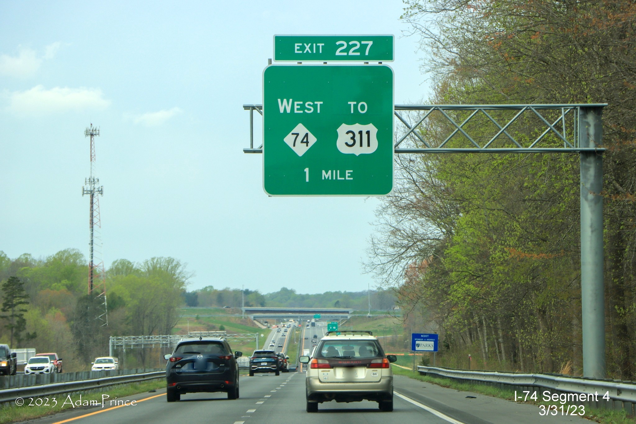Image of 1 mile advance overhead sign for NC 74 (Future I-74) West/Winston-Salem Northern Beltway 
        exit on US 421 North/Salem Parkway, Adam Prince, March 2023