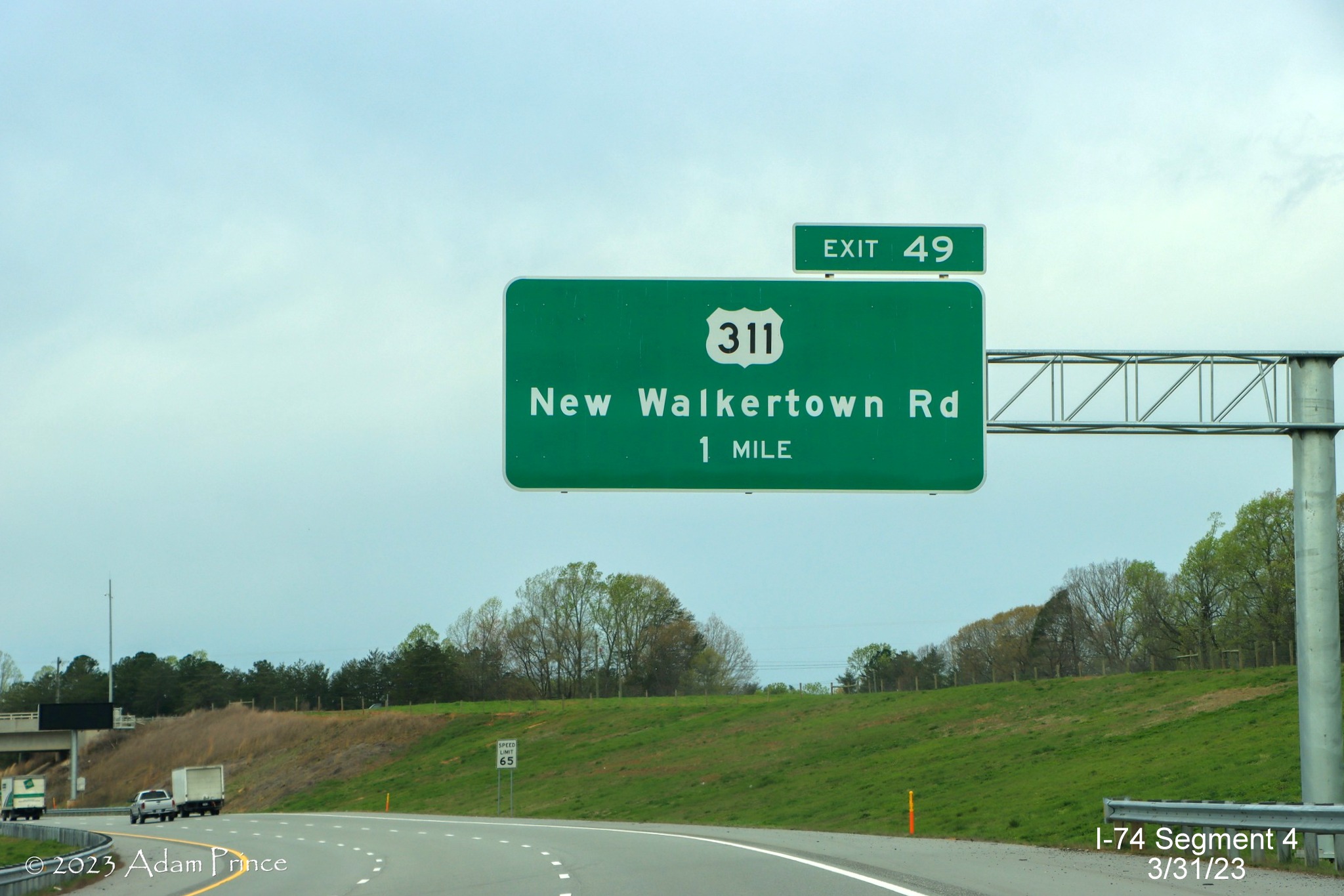 Image of 1 mile advance sign for US 311 exit on NC 74 (Future I-74) West/Winston-Salem 
        Northern Beltway, Adam Prince, March 2023