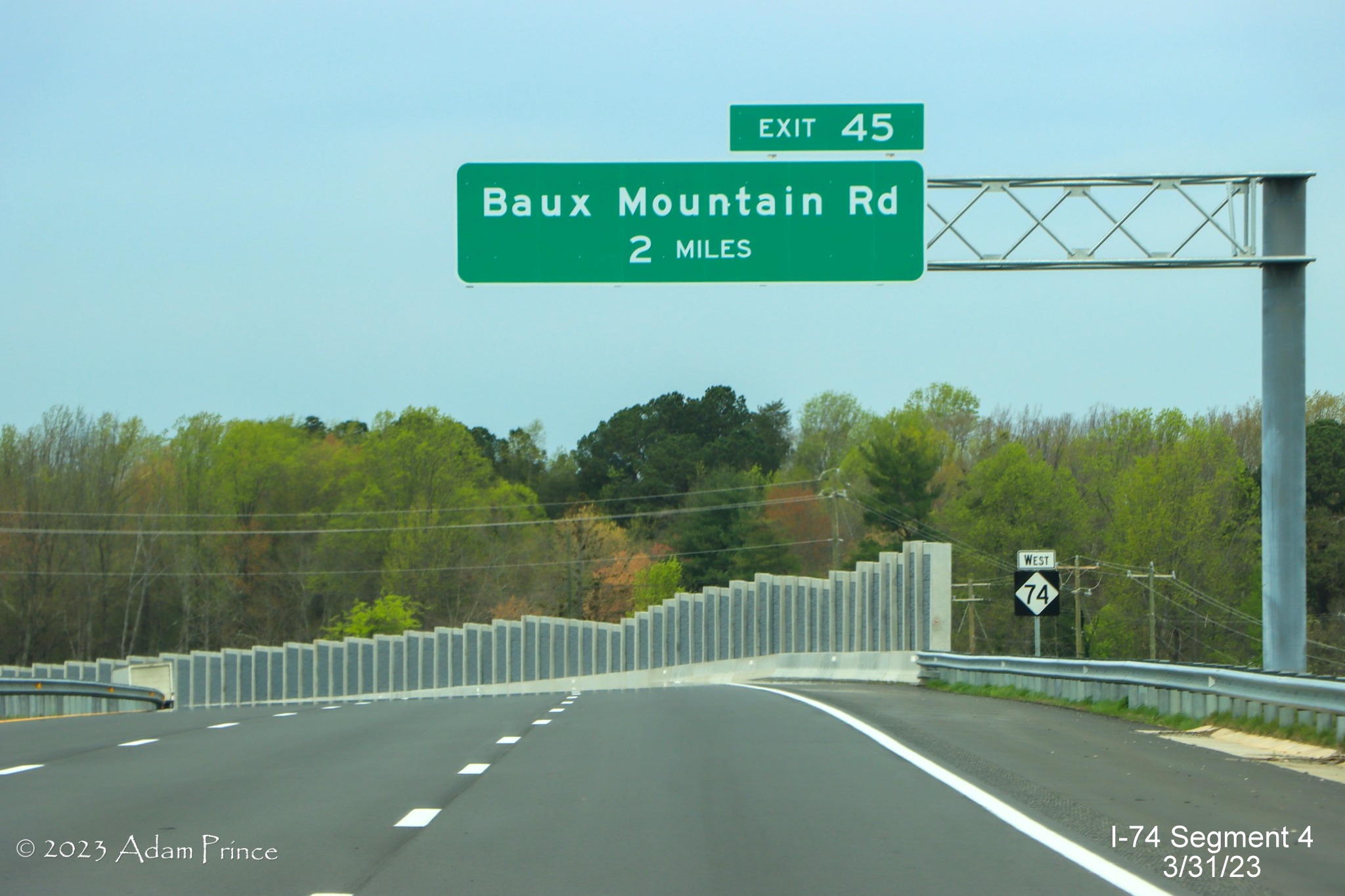 Image of 2 Miles advance sign for Baux Mountain Road exit on NC 74 (Future I-74) West/Winston-Salem 
        Northern Beltway, Adam Prince, March 2023