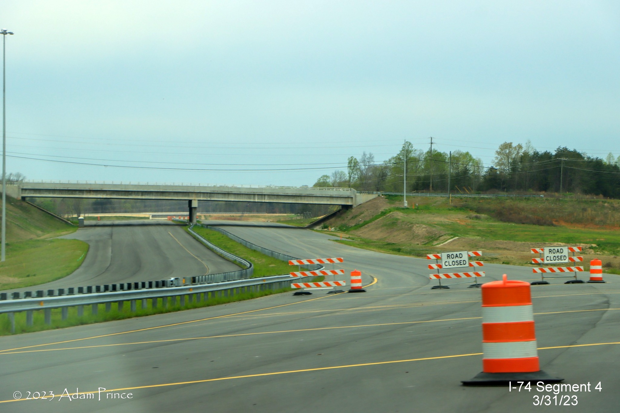 Image of continuing roadway at the current end of NC 74 (Future I-74) West/Winston-Salem 
        Northern Beltway towards US 52, Adam Prince, March 2023