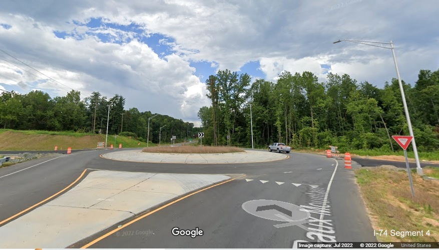 Image of new roundabout along Baux Mountain Road south of unopened Winston-Salem Northern 
          Beltway and future ramp from NC 74 (Future I-74) East, Google Maps Street View, July 2022