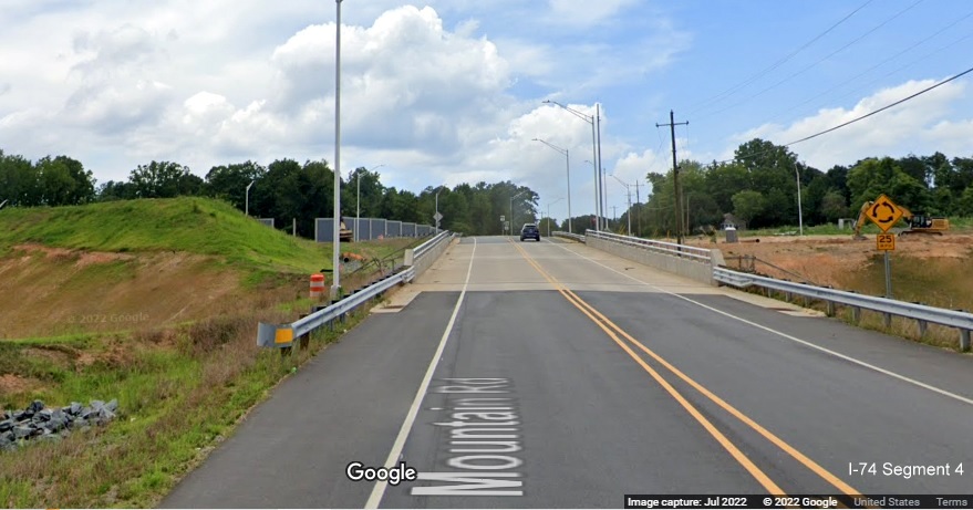 Image of new Baux Mountain Road bridge over unopened Winston-Salem Northern 
          Beltway / NC 74 (Future I-74), Google Maps Street View, July 2022