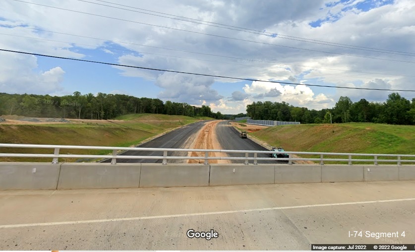 Image looking west from Baux Mountain Road bridge along unopened Winston-Salem Northern 
          Beltway / NC 74 (Future I-74) West, Google Maps Street View, July 2022