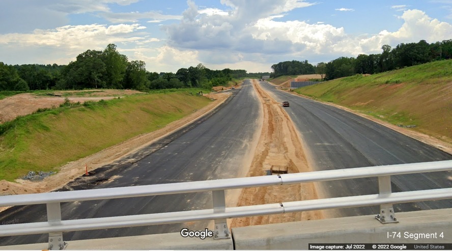 Image looking east from Baux Mountain Road bridge along unopened Winston-Salem Northern 
          Beltway / NC 74 (Future I-74) East, Google Maps Street View, July 2022