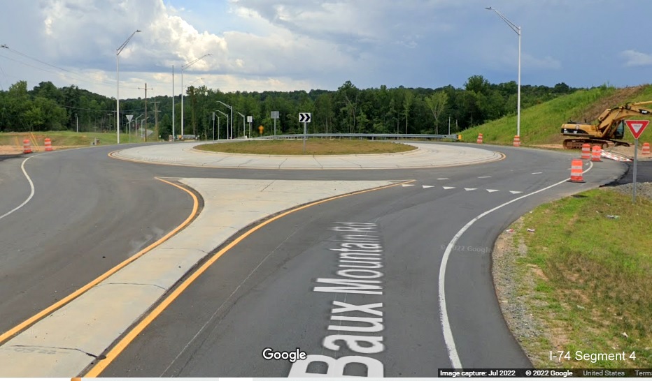 Image looking toward Baux Mountain Road roundabout and future on and off-
          ramps from unopened Winston-Salem Northern Beltway / NC 74 (Future I-74) West, Google Maps Street View, July 2022