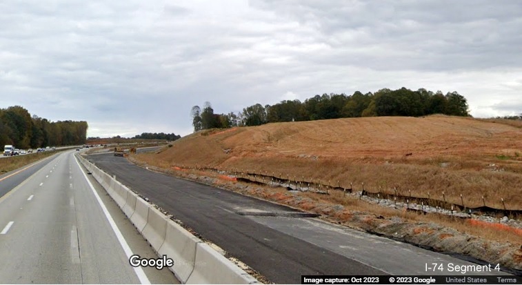 Image of construction between paved future ramps to I-74/Winston-Salem Northern Beltway from I-40 East 
        in Forsyth County, Google Maps Street View, October 2023