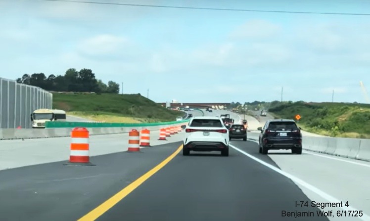 Image of lane shift on I-40 West to future eastbound lanes approaching interchange
	  of Winston-Salem Northern Beltway, screen grab from Benjamin Wolf video, June 2025