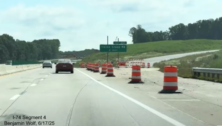 Image of traffic on I-40 East passing the future off-ramp to
	  the I-74 / Winston-Salem Northern Beltway, screen grab from Benjamin Wolf video, June 2025