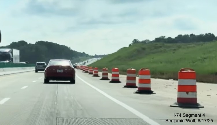 Image of traffic on I-40 East passing the future off-ramp to
	  the I-74 / Winston-Salem Northern Beltway, screen grab from Benjamin Wolf video, June 2025