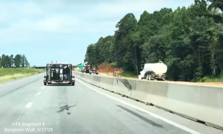 Image of traffic on I-74 East passing the future off-ramp to
	  the NC 192 in the Winston-Salem Northern Beltway interchange work zone, screen grab from Benjamin Wolf video, June 2025
