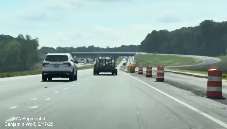 Image of traffic on I-74 East approaching the future off-ramp to I-74 West /
	  Winston-Salem Northern Beltway, screen grab from Benjamin Wolf video, June 2025