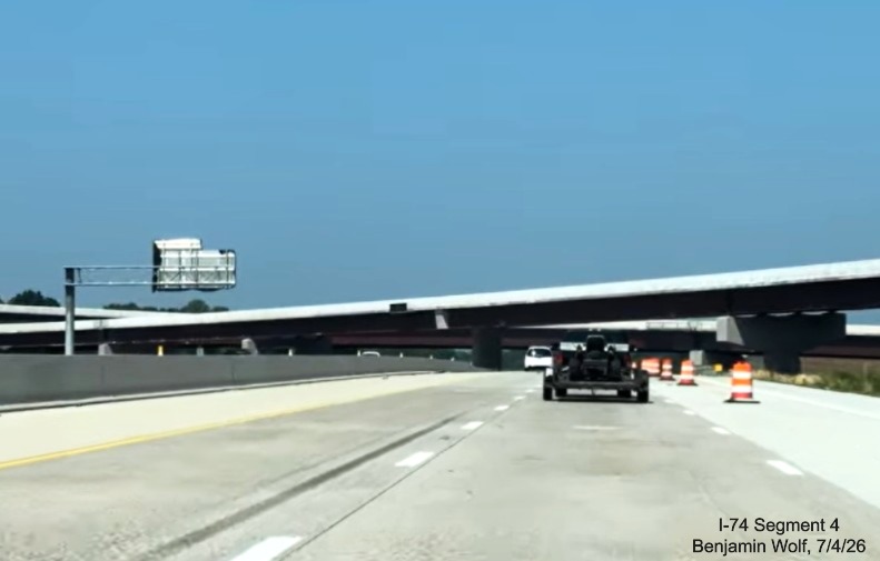 Image of I-40 West roadway approaching I-74/Winston-Salem Northern Beltway
	 flyover ramps, near completion, screen grab from Benjamin Wolf video, July 4, 2026