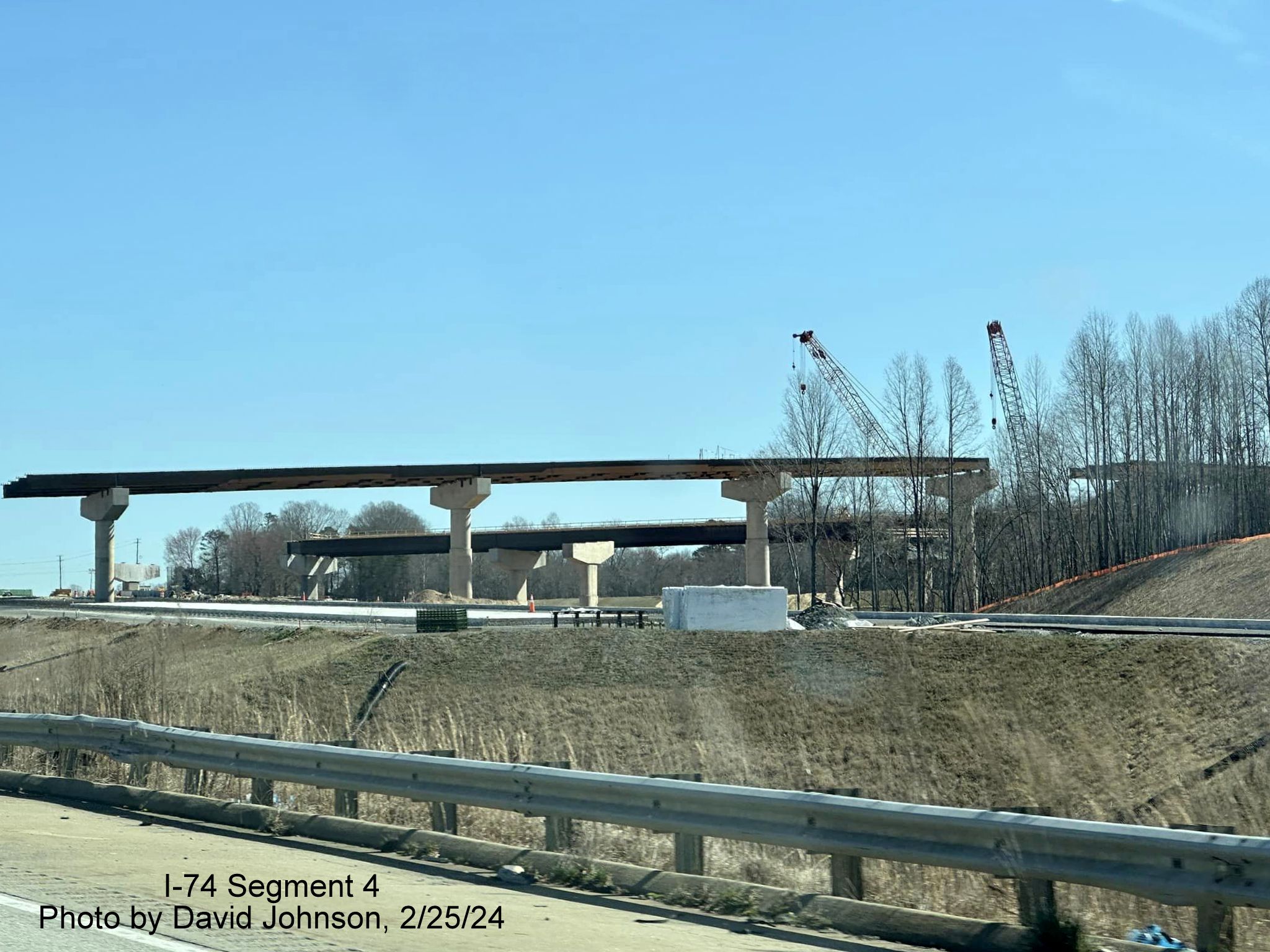 Image of work proceeding on building the future flyover ramps to I-74/Winston-Salem Northern 
        Beltway from I-40 East in Forsyth County, by David Johnson, February 2024