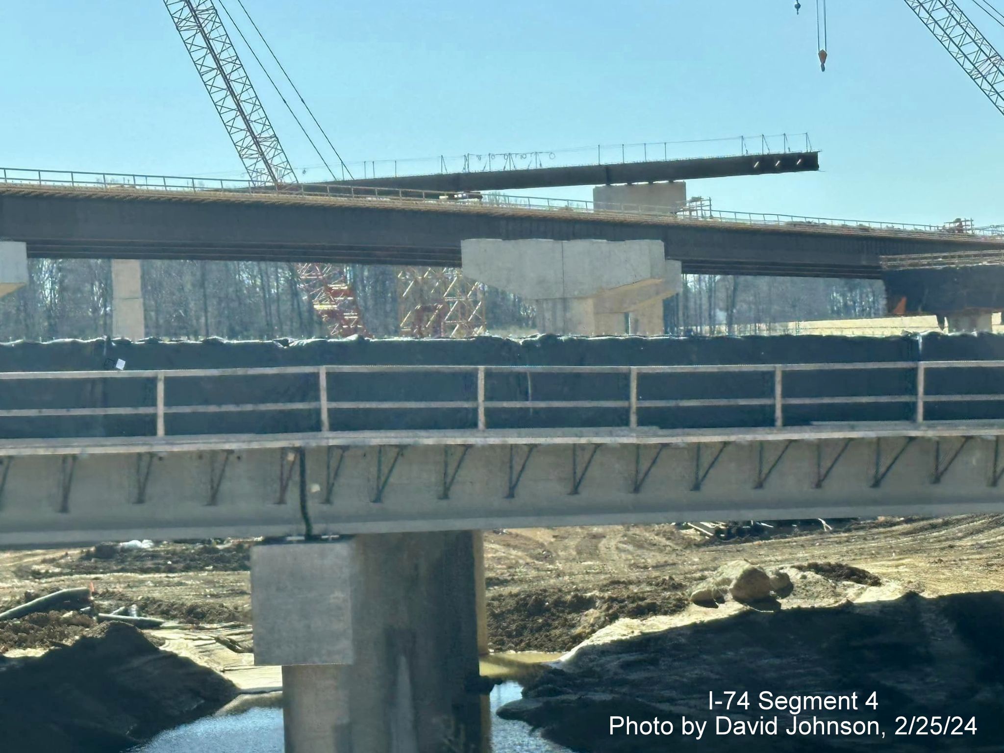 Image of future I-40 bridge and flyover ramps under construction as part of I-74/Winston-Salem 
        Northern Beltway construction from current I-40 East in Forsyth County, by David Johnson, February 2024