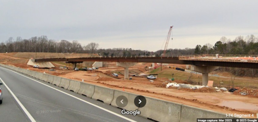 Image of the future ramp for NC 192 traffic under construction above the future
	  Winston-Salem Northern Beltway lanes for I-74 West, Google Maps Street View, March 2025
