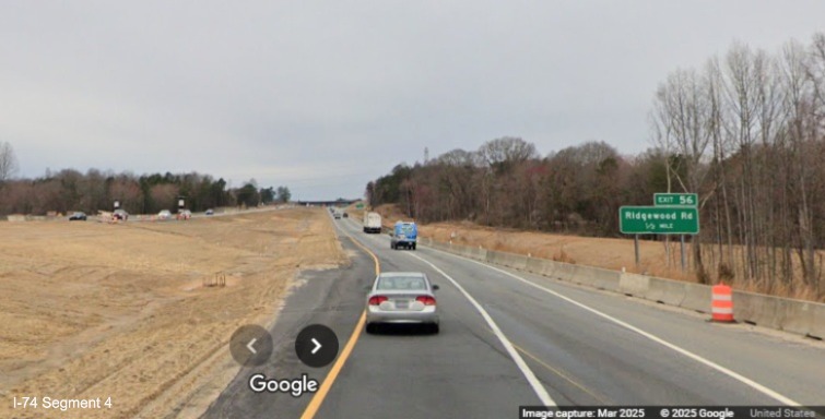 Image of looking along the future I-74 West lanes towards the Ridgewood Road exut 
	  and the end of the Winston-Salem Northern Beltway interchange project work zone, Google Maps Street View, March 2025