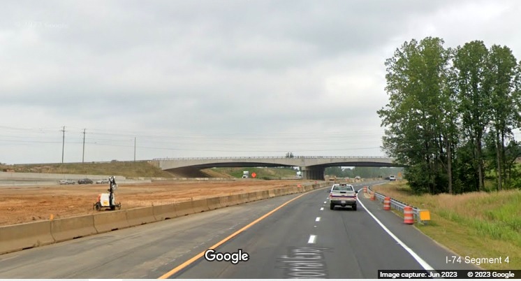 Image of US 52 North lanes using future C/D ramp roadway paralleling future I-74 West lanes 
        still under construction as part of the future Winston-Salem Northern Beltway interchange construction project, Google Maps Street View,         June 2023