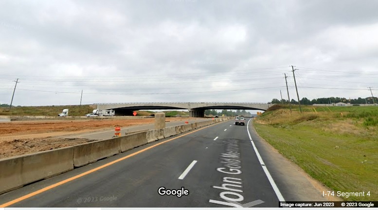 Image of US 52 North roadway heading under NC 65 brudge in 
        future Winston-Salem Northern Beltway interchange construction project work zone, Google Maps Street View, June 2023