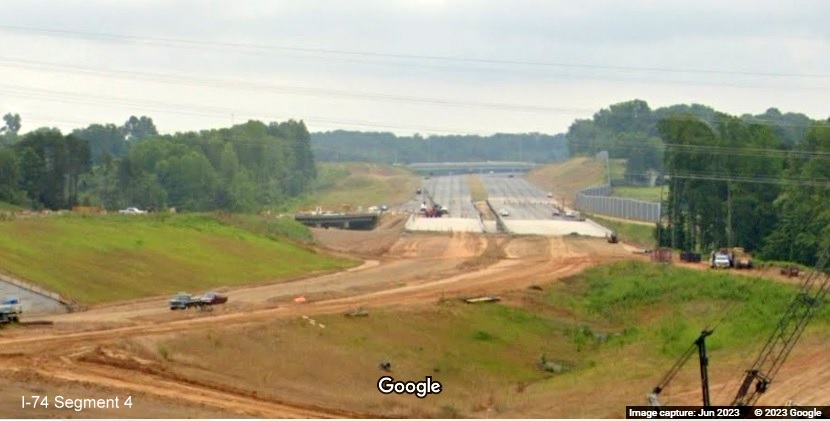 Image from US 52 North roadway looking east along future path of I-74 to NC 66 bridge, being built
        as part of the future Winston-Salem Northern Beltway interchange, Google Maps Street View, June 2023