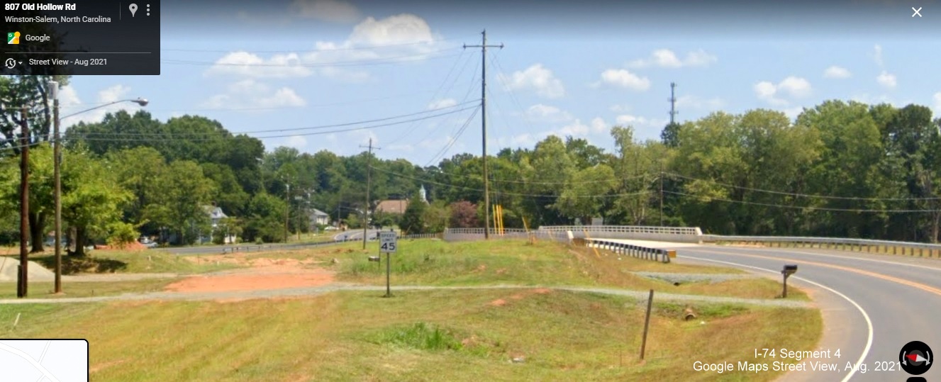 Image of rerouted NC 66/Old Hollow Road approaching bridge of future NC 74/Winston-Salem Northern 
        Beltway, Google Maps Street View image, August 2021