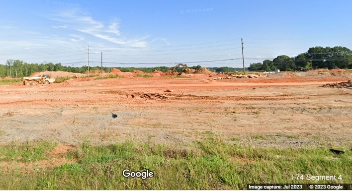 Image looking north from Kernersville Road over future I-74/Winston-Salem Northern Beltway 
       interchange under construction, Google Maps Street View image, July 2023