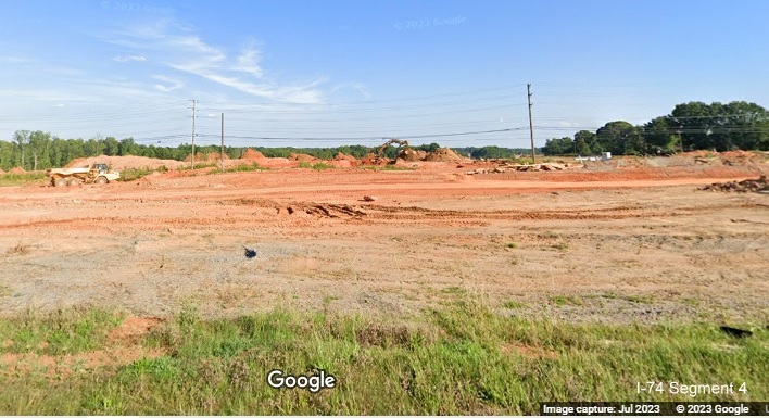 Image looking north from Kernersville Road over future I-74/Winston-Salem Northern Beltway 
       interchange under construction, Google Maps Street View image, July 2023