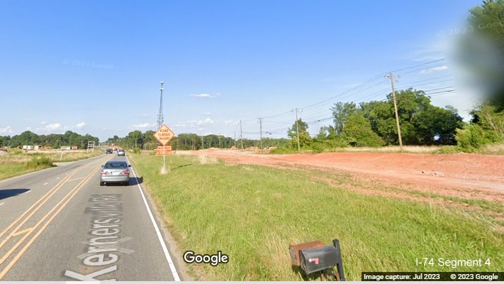 Image looking at grading of temporary roadway taking Kernersville Road through future I-74/Winston-Salem Northern Beltway 
       interchange construction area, Google Maps Street View image, July 2023