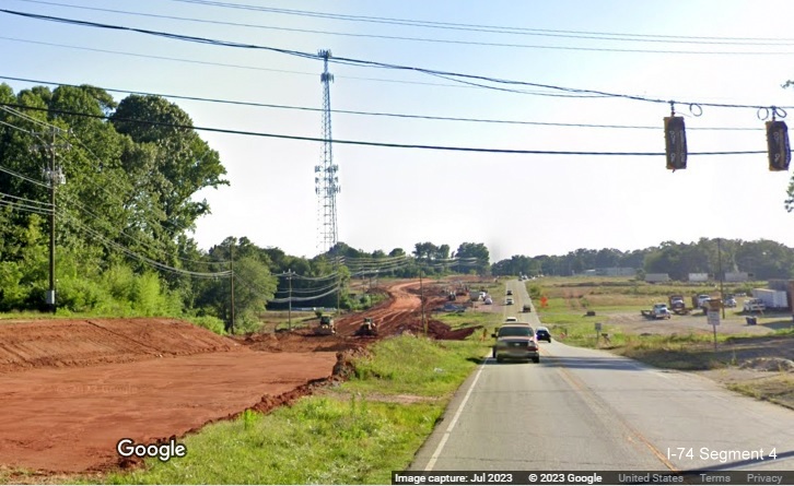 Image looking south along Kernersville Road toward future I-74/Winston-Salem Northern Beltway 
       interchange under construction, Google Maps Street View image, July 2023