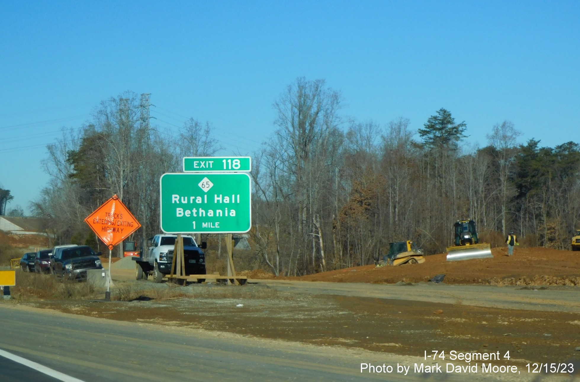 Image of US 52 North at the future off-ramp to NC 74 East/Winston-Salem Northern
      Beltway after the Ziglar Road bridge, by Mark David Moore, December 2023