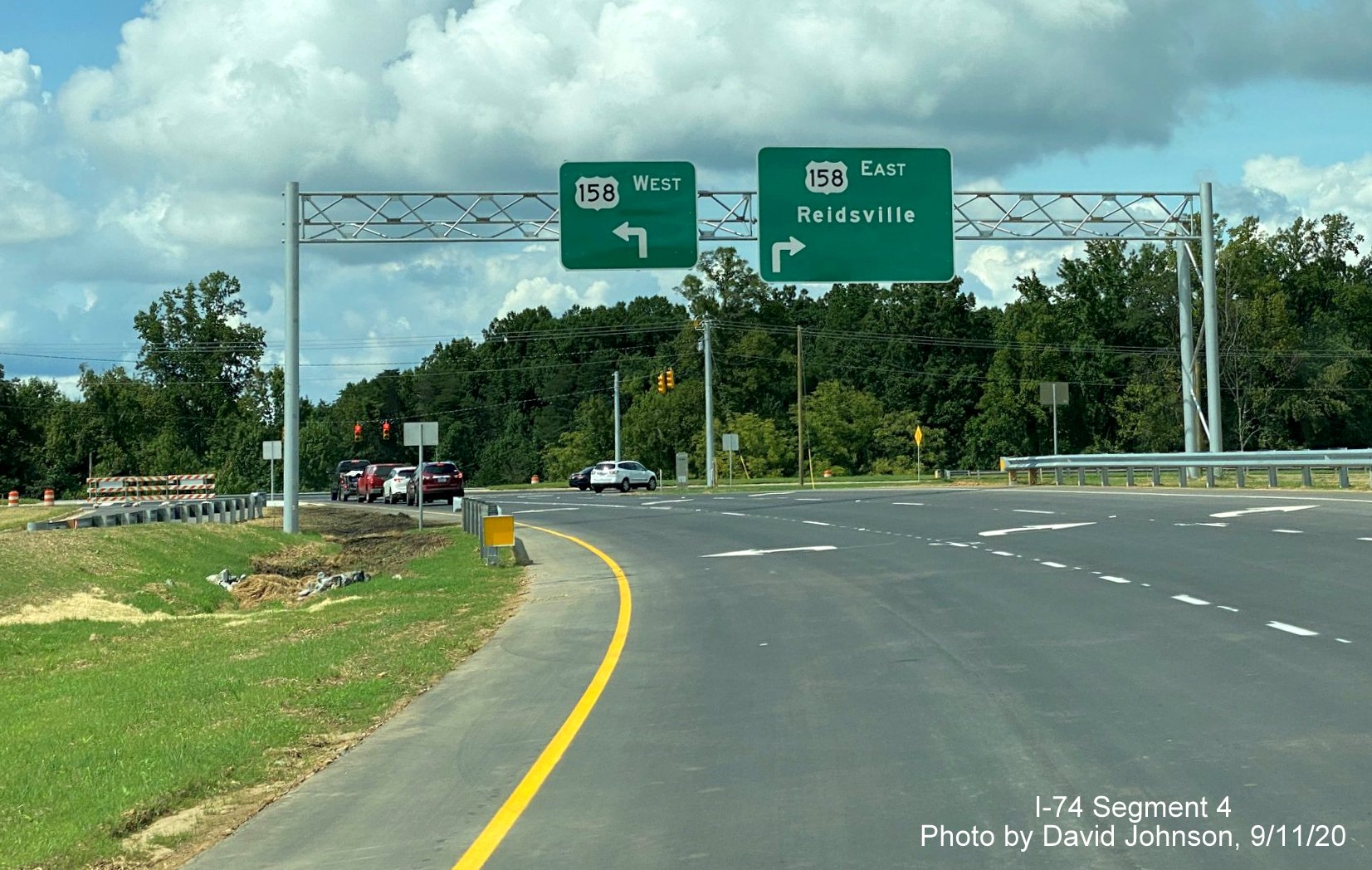 Image of overhead guide signs at the end of the ramp from NC 74 (Future I-74) West Winston Salem Northern Beltway to US 158, by David Johnson September 2020