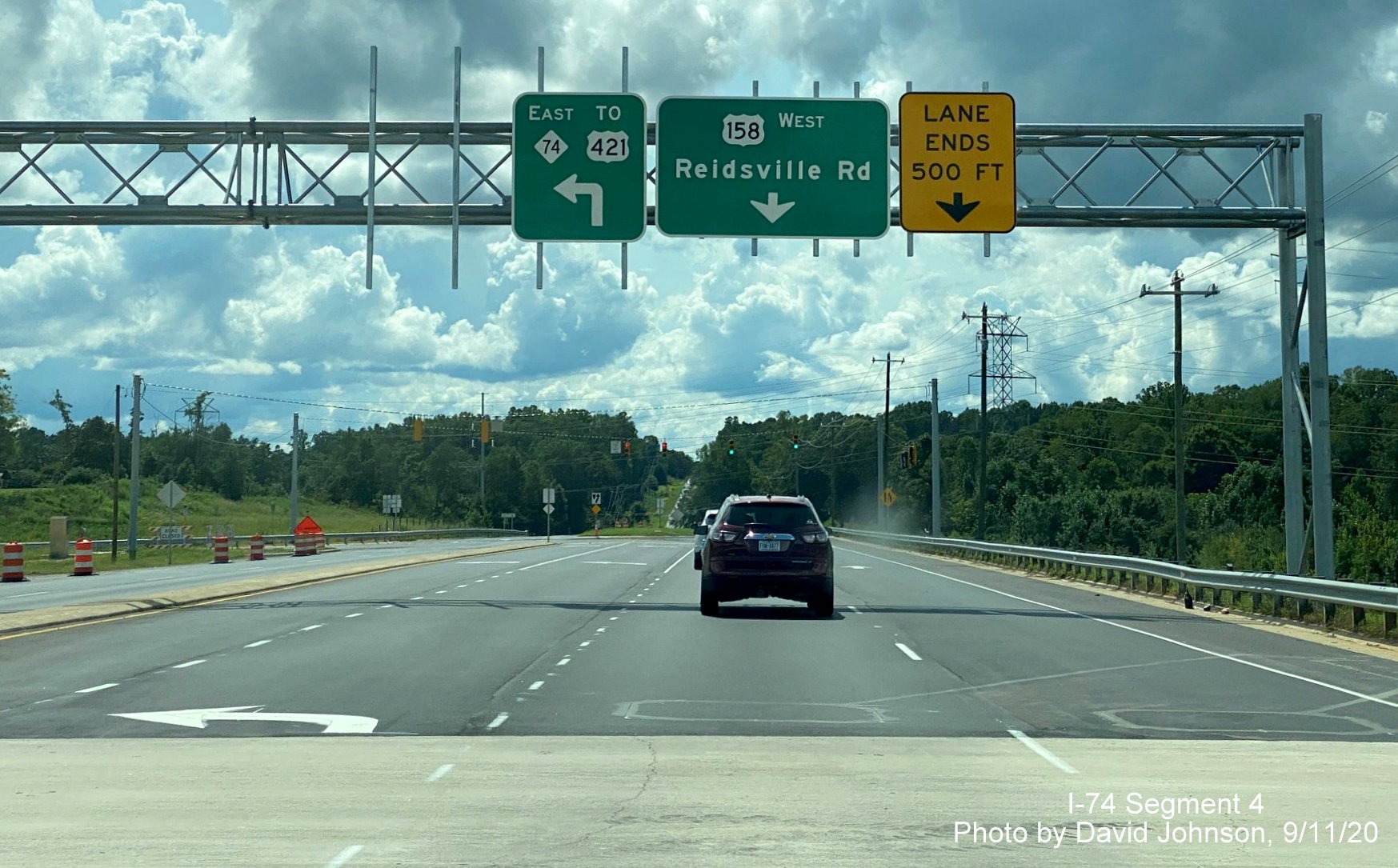 Image of overhead guide signs at ramp from US 158 West to NC 74 (Future I-74) East Winston Salem Northern Beltway, by David Johnson September 2020