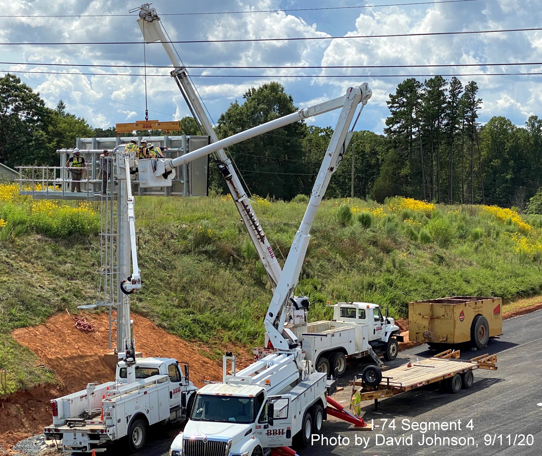 Image of VMS sign being constructed along Future I-74 Winston Salem Northern Beltway
        looking east from Williston Road bridge, by David Johnson September 2020