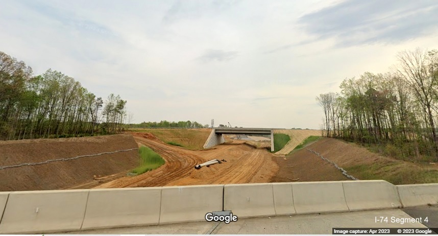 Image of future US 52 North lanes near completion and bridge over future Northern Beltway lanes, 
        Google Maps Street View image, April 2023