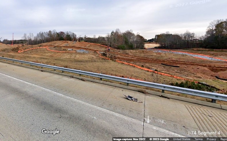 Image of clearing and grading along I-40 East lanes for future interchange with I-74/Winston-Salem 
       Northern Beltway in Forsyth County, Google Maps Street View, November 2022