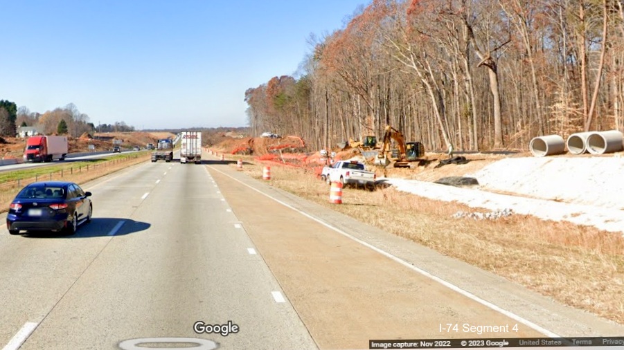 Image of clearing and grading and some concrete pipes along I-40 West lanes after Union Cross Road for future interchange with I-74/Winston-Salem 
       Northern Beltway in Forsyth County, Google Maps Street View, November 2022