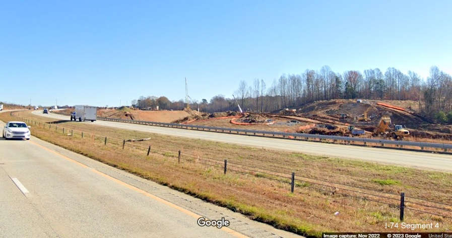 Image of clearing and grading along I-40 East lanes for future interchange with I-74/Winston-Salem 
       Northern Beltway in Forsyth County, Google Maps Street View, November 2022